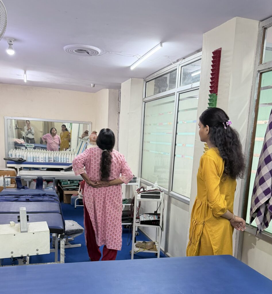 Dr. Suman Choudhary assessing a patient's posture at UR Physio Clinic, Murlipura, Jaipur